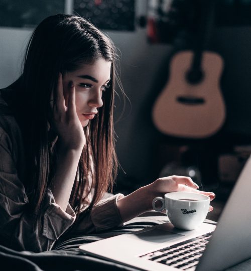 photo-of-woman-lying-on-bed-while-using-laptop-4066041